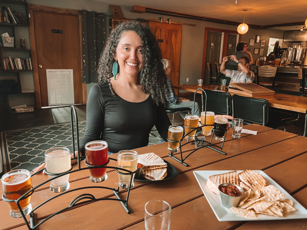 A woman at Hex and Hop Brewery in Saranac Lake Region